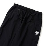 N logo side-zip nylon pants