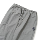 N logo side-zip nylon pants