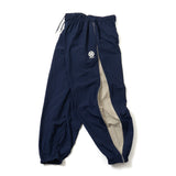 N logo side-zip nylon pants