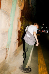 DEFORMATION LINE NYLON PANTS