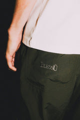 DEFORMATION LINE NYLON PANTS