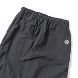N logo side-zip nylon pants