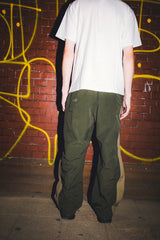 DEFORMATION LINE NYLON PANTS