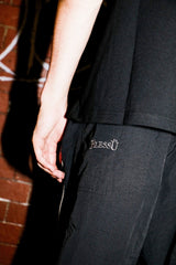 DEFORMATION LINE NYLON PANTS