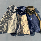 9090 × UMBRO RAGLAN ANORAK