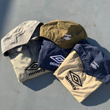 9090 × UMBRO RAGLAN ANORAK