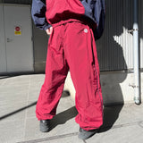 N logo side-zip nylon pants