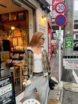 reversible check pattern zip stand