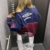 9090 × UMBRO CITY LOGO NYLON JACKET
