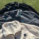 writing flower logo fleece half zip