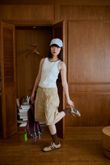 背の喪失感とリボン結びタンク