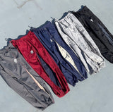 N logo side-zip nylon pants