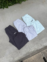 FILA × HTH 스웨트팬츠 