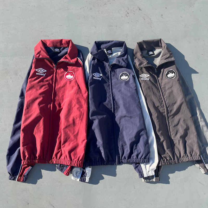9090 × umbro City Logo Nylon Jacket – YZ 9090 × umbro City Logo Nylon Jacket – YZ