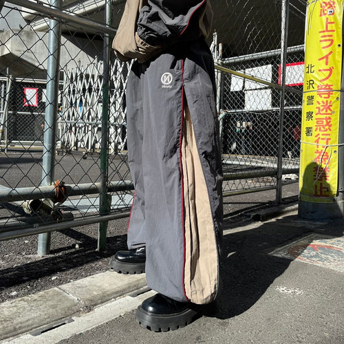 N logo side-zip nylon pants