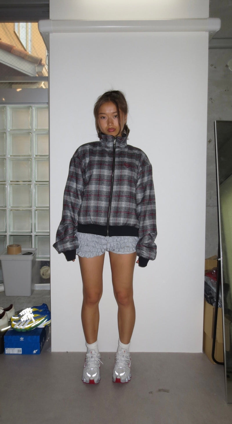 reversible check pattern zip stand