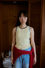 背の喪失感とリボン結びタンク