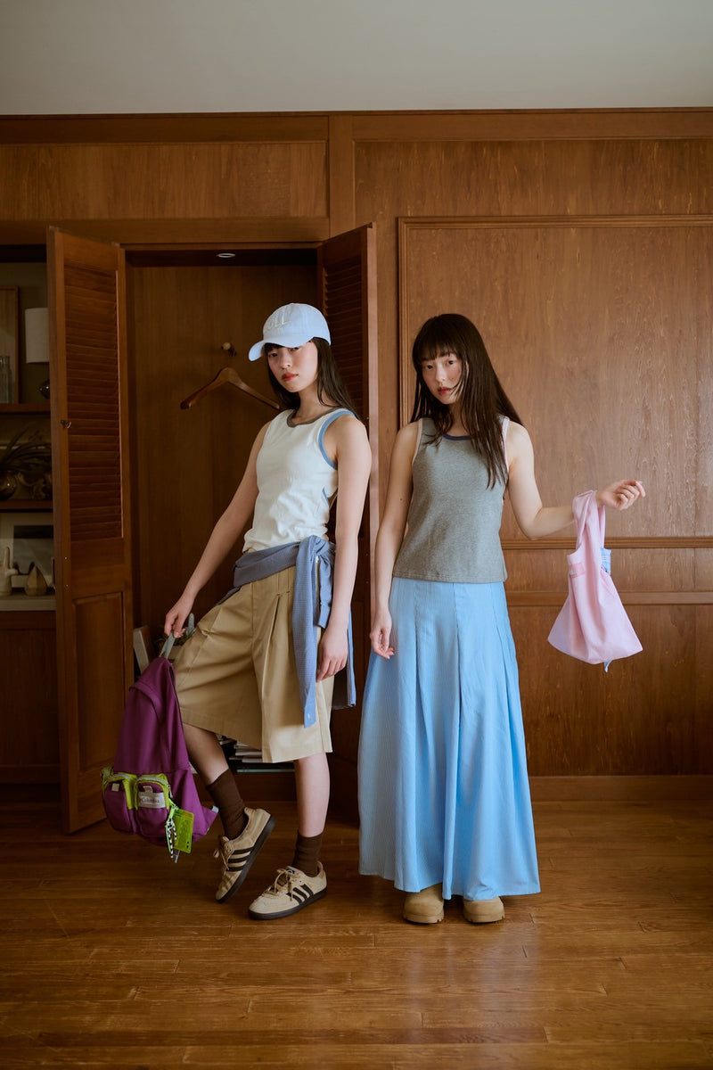 背の喪失感とリボン結びタンク