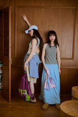 背の喪失感とリボン結びタンク