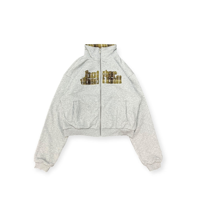 reversible check pattern zip stand