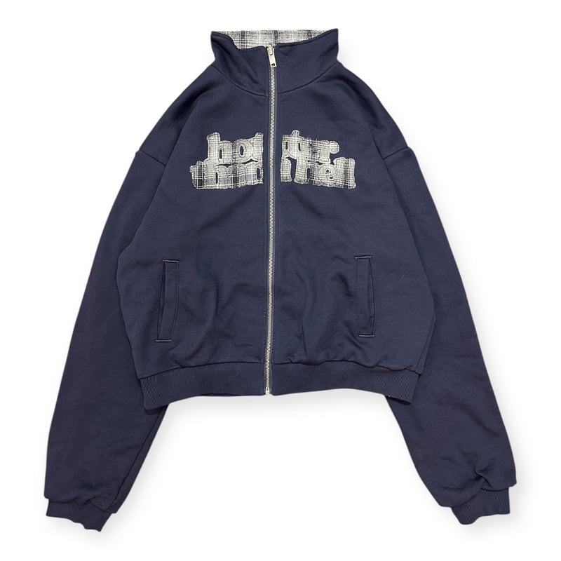 reversible check pattern zip stand